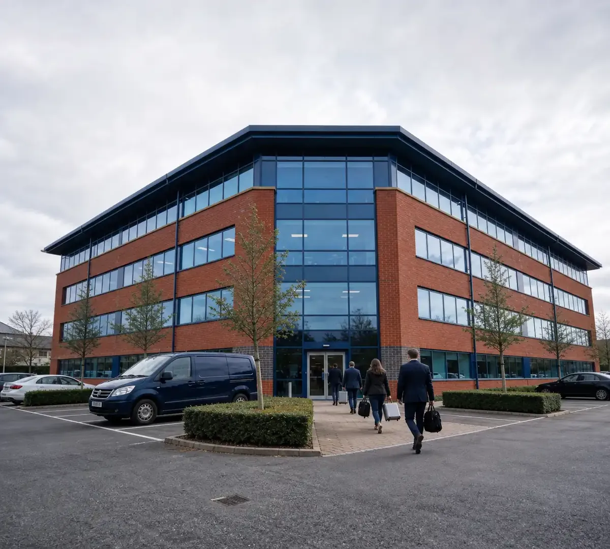 Office building on a Hampshire business park with staff arriving for work